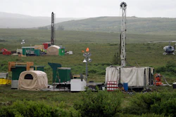 In this July 13, 2007 file photo, workers with the Pebble Mine project test drill in the Bristol Bay region of Alaska near the village of Iliamma. The Trump administration settled a lawsuit Friday, May 12, 2017, over the proposed development of a massive gold and copper mine at the headwaters of one of Alaska's premier salmon fisheries. The Environmental Protection Agency settled the long-running case with the Pebble Limited Partnership, agreeing to allow the Canadian-owned company to seek a federal permit to build its mine near Bristol Bay.