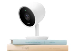 This photo provided by Nest Labs shows the Nest Cam IQ. Nest Labs is adding Google's facial recognition technology to a high-resolution security camera that will provide a glimpse at the potential for increasingly intelligent, internet-connected computers to see and understand everything going on in people's homes.