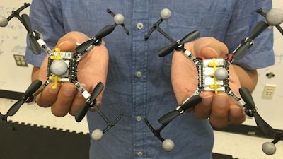 The quadcopters wear virtual 'top hats,' to avoid flying underneath each other.