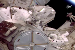 This still image provided by NASA shows astronauts Jack Fischer, left, and Peggy Whitson on a spacewalk outside the International Space Station on Friday, May 12, 2017. An equipment water leak has shortened the spacewalk. During preparations earlier in the morning, water leaked from the connection point between an umbilical hose and Fischer's suit. The hose is one of two that provide water, oxygen, power, cooling and communications for astronauts before they float outside.