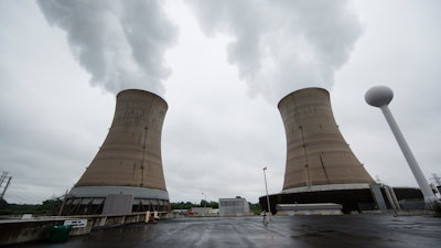 A Monday, May 22, 2017 file photo shows cooling towers at the Three Mile Island nuclear power plant in Middletown, Pa. Exelon Corp., the owner of Three Mile Island, site of the United States' worst commercial nuclear power accident, said Monday, May 29, 2017 it will shut down the plant in 2019 without a financial rescue from Pennsylvania.
