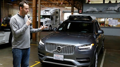 In this Dec. 13, 2016, file photo, Anthony Levandowski, head of Uber's self-driving program, speaks about their driverless car in San Francisco. Uber has followed through on threats to fire Levandowski, a star autonomous car researcher whose hiring touched off a bitter legal fight with Waymo, the former self-driving car arm of Google. Waymo has alleged that Levandowski downloaded 14,000 documents containing trade secrets before he founded a startup that was purchased by Uber.