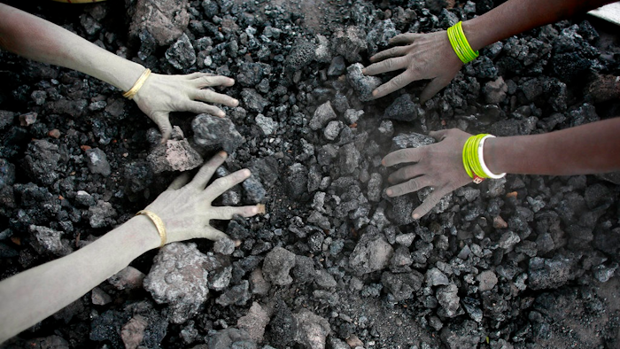 In this Monday, Dec. 14, 2015, file photo, Indian women use bare hands to pick reusable pieces from heaps of used coal discarded by a carbon factory in Gauhati, India. The world’s biggest coal users - China, the United States and India - have boosted coal mining in 2017, in an abrupt departure from last year’s record global decline for the heavily polluting fuel and a setback to efforts to rein in climate change emissions.
