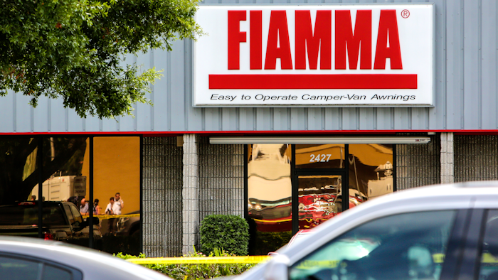 Law enforcement investigate the scene where they said there were multiple fatalities at Fiamma, an awning factory, in an industrial area near Orlando, Fla., Monday, June 5, 2017. The Orange County Sheriff's Office said on its official Twitter account that the situation has been contained.