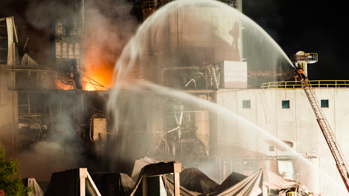 In this photo provided by Jeff Lange, firefighters work at the scene following an explosion and fire at the Didion Milling plant in Cambria, Wis., Thursday, June 1, 2017. Recovery crews searched a mountain of debris on Thursday following a fatal explosion late Wednesday at the corn mill plant, which injured about a dozen people and leveled parts of the sprawling facility in southern Wisconsin, authorities said.