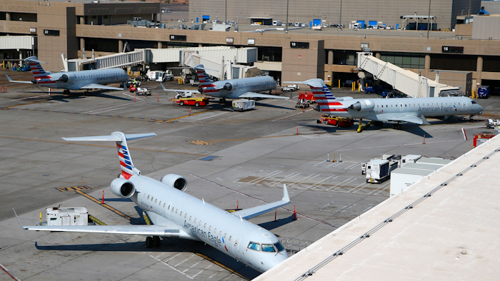At Phoenix Sky Harbor International Airport American Airlines regional jets sit on the tarmac as American Airlines says seven regional flights have been delayed and 43 have been canceled because of a heat wave as temperatures climb to near-record highs Tuesday, June 20, 2017, in Phoenix.