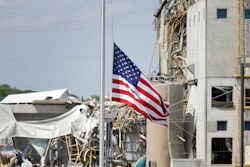 An American flag flies at half-staff in front of the Didion Ethanol Plant in the Village of Cambria, Wis., Friday, June 2, 2017. An explosion at the next-door Didion Milling Plant, background, on Wednesday night killed three employees and injured about a dozen others.