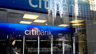 In this Thursday, March 16, 2017, file photo, a customer enters a Citibank branch, in New York. On Thursday, June 22, 2017, the Federal Reserve said all of the 34 largest U.S. banks are fortified enough to withstand a severe U.S. and global recession and continue lending. The banks undergoing the seventh annual check-up included JPMorgan Chase & Co., Bank of America Corp., Citigroup Inc. and Wells Fargo and Co., which are the four biggest U.S. banks by assets.