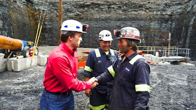 George Dethlefsen, left, CEO of Corsa Coal, speaks with a miner in a coal pit in Friedens, Pa., Wednesday, June 7, 2017. Corsa Coal Corp. says the mine will create 70 to 100 new jobs and produce some 400,000 tons of metallurgical coal a year. President Donald Trump referred to the mine's opening during a speech announcing his intent to withdraw from the Paris climate accords.