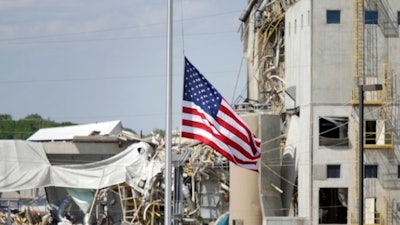 A flag flew at half-staff, following an explosion at Didion Milling this past month.