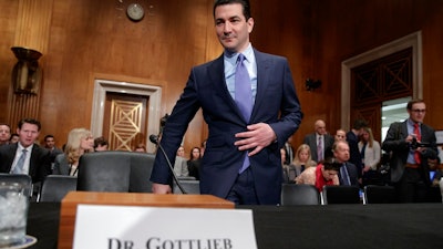 In this Wednesday, April 5, 2017, file photo, Dr. Scott Gottlieb, President Donald Trump's nominee to head the Food and Drug Administration, appears at his confirmation hearing before the Senate Committee on Health, Education, Labor, and Pensions, on Capitol Hill in Washington. The Food and Drug Administration is making two moves to rapidly increase the number of generic prescription drugs on sale in an effort to make medicines affordable and prevent future price gouging. New commissioner Gottlieb says the FDA will now give priority reviews to potential generic drugs until at least three are on the market. That’s the level at which prices tend to drop sharply, up to 85 percent off the brand-name price.