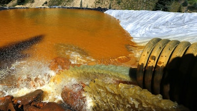 In this Aug. 14, 2015, file photo, water flows through a series of sediment retention ponds built to reduce heavy metal and chemical contaminants from the Gold King Mine wastewater accident outside Silverton, Colo. The Environmental Protection Agency had no rules for working around old mines when the agency inadvertently triggered the massive spill from the Colorado mine that polluted rivers in three states, government investigators said Monday, June 12, 2017.