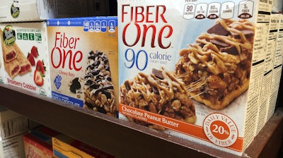 In this Tuesday, June 13, 2017, photo, Fiber One bars sit on a shelf at a market, in New York. Snack bars, cereals and brownies with added fiber may not appear as filling under a new labeling rule. A little-discussed aspect of the revamped Nutrition Facts panel, which was postponed Tuesday, June 13, is that it could change what ingredients products like Fiber One bars can count as dietary fiber. The unsettled details are partly why the industry has called for delaying the deadline to use the new panel.