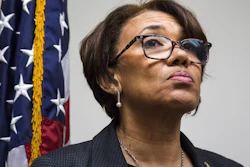In this June 20, 2017, file photo, Flint, Mich. Mayor Karen Weaver listens to a question during a closed news conference discussing the water source recommendation made for Flint at City Hall. The state of Michigan sued Flint on Wednesday, June 28, 2017, alleging that the city council's refusal to approve a broadly backed deal to buy water long term from a Detroit-area system is endangering public health in the wake of a man-made crisis that left the supply contaminated with lead. The Department of Environmental Quality had threatened legal action if the council did not approve Weaver's recommendation or propose a reasonable alternative by Monday.