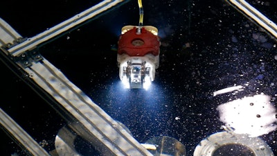 A newly developed robot for underwater investigation of a Fukushima damaged reactor moves through the water at a test facility in Yokosuka near Tokyo Thursday, June 15, 2017. The robot, co-developed by the debt-strapped Japanese nuclear and electronics company Toshiba Corp., and the International Research Institute for Nuclear Decommissioning, is ready for deployment this summer at the badly-damaged Unit 3 primary containment vessel to assess its damage and locate parts of melted fuel, believed to be submerged under highly contaminated water.