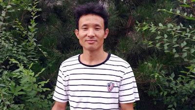 In this photo taken 2016 and released by Deng Guilian, Hua Haifeng is seen during a visit to a park in Chengde in central China's Hubei province. Hua has been arrested and another two have gone missing following their investigations into working conditions at a Chinese factory that produces Ivanka Trump-brand shoes, a family member and an advocacy group said Tuesday, May 30, 2017. China Labor Watch Executive Director Li Qiang said he lost contact with Hua Haifeng and the other two men, Li Zhao and Su Heng, over the weekend. By Tuesday, after dozens of unanswered calls, he had concluded: “They must be held either by the factory or the police to be unreachable.”