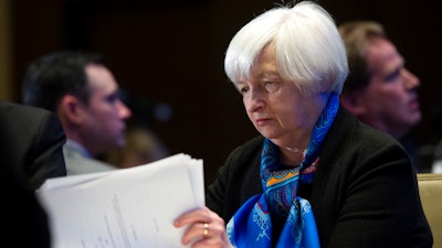In this Thursday, March 23, 2017, file photo, Federal Reserve Chair Janet Yellen looks at documents while waiting to speak at the Federal Reserve System Community Development Research Conference in Washington. When the Federal Reserve meets Wednesday, June 14, 2017, it's all but sure to raise its benchmark short-term interest rate for the third time in six months.
