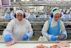 In this March 21, 2017 file photo, workers prep poultry at the meatpacking company JBS in Lapa, Brazil. In a major blow to Brazil, the United States on Thursday, June 22, 2017 announced the immediate suspension of all imports of beef products from Latin America’s largest nation because of safety concerns.