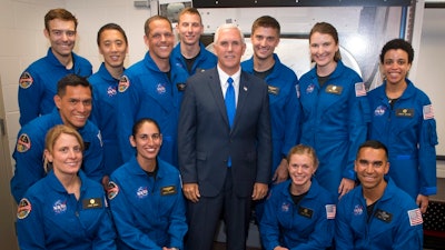 Vice President Mike Pence poses for a group photograph with NASA's 12 new astronaut candidates, Wednesday, June 7, 2017, at NASA's Johnson Space Center in Houston, Texas. NASA chose 12 new astronauts Wednesday from its biggest pool of applicants ever, selecting seven men and five women who could one day fly aboard the nation's next generation of spacecraft.