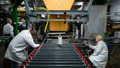 FILE - In this Thursday, March 23, 2017, file photo, workers manufacture thermal protection systems for NASA at Bally Ribbon Mills in Bally, Pa. Forecasts for U.S. economic growth are coming in slightly lower after a weak first quarter, according to a survey of business economists released Monday, June 5.