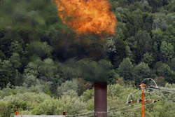 In this June 15, 2005 file photo, flames from methane burning at the landfill in Coventry, Vt. The Trump administration is delaying two Obama-era regulations aimed at restricting harmful methane emissions from oil and gas production.