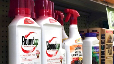 In this Thursday, Jan. 26, 2017, photo, containers of Roundup, left, a weed killer is seen on a shelf with other products for sale at a hardware store in Los Angeles. California regulators are taking a pivotal step toward requiring the popular weed killer Roundup to come with a warning label. The state's Office of Environmental Health Hazard Assessment announced Monday, June 26, 2017, that the weed killer's main ingredient, glyphosate, will be listed in July as a chemical known to cause cancer.