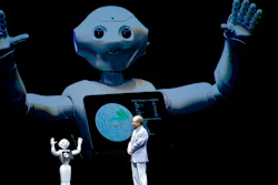 FILE - In this June 18, 2015, file photo, SoftBank Corp. CEO Masayoshi Son speaks with the company's companion robot Pepper during a press conference in Maihama, near Tokyo. The Japanese internet, solar and technology company is buying robotics pioneer Boston Dynamics from Alphabet Inc., Google's parent, announced Friday, June 9, 2017. SoftBank said the purchase underlines how robotics is a key part of its business.