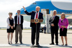 President Donald Trump, accompanied by Michael and Tammy Kushman, left, and Robert and Sarah Stoll, right, speaks in front of Air Force One, Tuesday, June 13, 2017, at General Mitchell International Airport in Milwaukee, Wis.