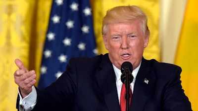 In this May 18, 2017 file photo, President Donald Trump speaks in the East Room of the White House in Washington. A White House official says President Donald Trump is expected to withdraw the United States from the Paris climate accord.