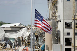An American flag flies at half-staff in front of the Didion Ethanol Plant in the Village of Cambria, Wis., Friday, June 2, 2017. An explosion at the next-door Didion Milling Plant, background, on Wednesday night killed three employees and injured about a dozen others.