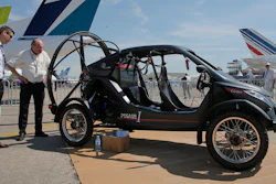 Visitors looks at the flying car Pegasus 1, built by French entrepreneur Jerome Dauffy at Paris Air Show, in Le Bourget, east of Paris, France, Tuesday, June 20, 2017 in Paris. Aviation professionals and spectators are expected at this week's Paris Air Show, coming in, in a thousands from around the world to make business deals.