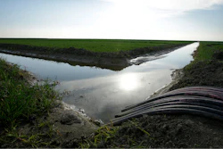 In this Feb. 25, 2016, file photo, water flows through an irrigation canal to crops near Lemoore, Calif. The federal regulators evaluating Gov. Jerry Brown's decades-old ambitions to re-engineer the water supplies from California's largest river are promising a status update Monday, June 26, 2017, as Brown's $16 billion proposal to shunt part of the Sacramento through two mammoth tunnels awaits a crucial yes or no from national agencies.
