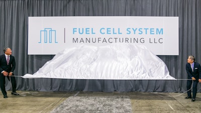 Fuel Cell System Manufacturing President Suheb Haq (left) and FCSM Vice President Tomomi Kosaka reveal the company's logo Wednesday, June 7, 2017, at the General Motors Brownstown Battery Assembly plant in Brownstown Township, Michigan. Fuel Cell System Manufacturing LLC is the joint venture company established by General Motors and Honda for the production of advanced hydrogen fuel cell systems.