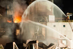 In this photo provided by Jeff Lange, firefighters work at the scene following an explosion and fire at the Didion Milling plant in Cambria, Wis., Thursday, June 1, 2017.