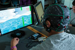 A subject plays a computer game as part of a neural security experiment at the University of Washington.