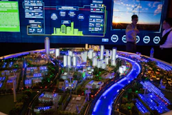 In this photo taken Wednesday, June 7, 2017, visitors look at a model of a city run on clean energy during an international clean energy conference held in Beijing, China. Energy ministers from around the world gathered in Beijing this week to report increased spending to help counter climate change. Yet one prominent voice, that of U.S. Energy Secretary Rick Perry, delivered a starkly countervailing message as the Trump administration seeks to roll back spending on clean energy and promote fossil fuels.