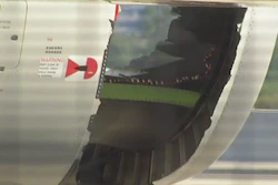 In this image made from video, a hole is seen in the engine of China Eastern airlines Flight 736 after it landed in Sydney, Australia, Monday, June 12, 2017. China Eastern said the crew on Flight 736 noticed damage to the air inlet on the left engine after takeoff Sunday evening and the captain decided to return.