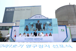 South Korean President Moon Jae-in, center, attends a ceremony marking the shutdown of the country's oldest nuclear power plant, Kori 1, in Busan, South Korea, Monday, June 19, 2017. Moon said Monday that South Korea will move away from the nuclear energy and will not seek to extend the life of existing nuclear plants. The sign reads ' A ceremony marking the shutdown of the Kori 1.'