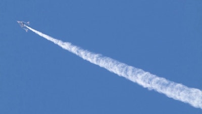 VSS Unity in-flight showing a contrail as water was released from the aft ballast tank.