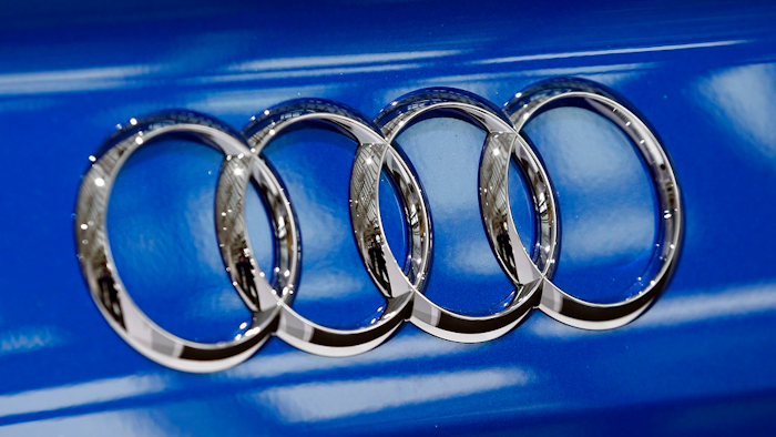In this March 3, 2016 file photo the four ring logo of German car producer Audi is photographed during the annual press conference in Ingolstadt, Germany. A former high-level executive for Volkswagen’s Audi luxury brand has been charged with conspiracy and accused of directing other employees to program vehicles to cheat on emissions tests. The Justice Department says Giovanni Pamio, an Italian citizen, was charged Thursday, July 6, 2017, in a criminal complaint with conspiracy, wire fraud and violating the Clean Air Act.