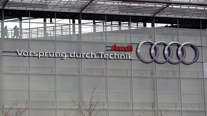 In this Wednesday, March 15, 2017 file photo, the four ring logo of German car producer Audi is photographed at the headquarters after the annual press conference in Ingolstadt, Germany. German automaker Audi says it will fit up to 850,000 diesel cars with new software to improve their emissions performance, following a similar move by rival Daimler as the auto industry tries to get ahead of public controversy over the technology. Audi, the luxury brand of the Volkswagen Group, announced the voluntary retrofitting program on Friday, July 21, 2017.