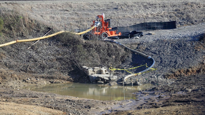 In this Thursday, Jan. 14, 2016, photo, a drainage pipe that was the original culprit of the coal ash spill is shown at the Dan River Steam Station in Eden, N.C. Duke Energy Corp. is digging up and hauling away from riverbanks the toxic coal residues two years after one of the worst coal-ash spills in U.S. history. The nation’s largest electric company now wants regulators in North Carolina to force consumers to pay nearly $200 million a year to clean up the toxic byproducts of burning coal to generate power. The request filed with state utility regulators in June 2017 is the first time Duke Energy Corp. has sought permission to have North Carolina consumers pay part of its costs of cleaning up the waste, which are estimated to total $5.1 billion in North and South Carolina alone.