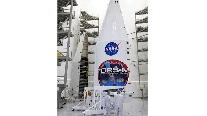 In a July 13, 2017 photo provided by NASA, the payload fairing for NASA's Tracking and Data Relay Satellite, TDRS-M, is inspected prior to encapsulating the spacecraft, inside the Astrotech facility in Titusville, Fla. NASA said Monday, July 17, 2017, that one of the antennas on the Tracking and Data Relay Satellite, was damaged last Friday. The mishap could delay what was supposed to be an Aug. 3 liftoff aboard an Atlas V (five) rocket.