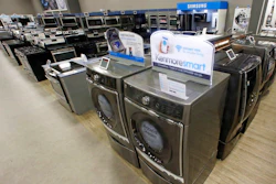 In this Thursday, July 20, 2017, file photo, the Kenmore Elite Smart Electric Dryer and Front Load Washer, center, appears on display at a Sears store, in West Jordan, Utah. On Thursday, July 27, 2017, the Commerce Department releases its report on durable goods for June.