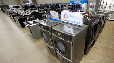 In this Thursday, July 20, 2017, file photo, the Kenmore Elite Smart Electric Dryer and Front Load Washer, center, appears on display at a Sears store, in West Jordan, Utah. On Thursday, July 27, 2017, the Commerce Department releases its report on durable goods for June.