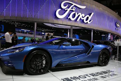 In this Wednesday, April 19, 2017, file photo, a sports car is displayed at the Ford stand during the Auto Shanghai 2017 show at the National Exhibition and Convention Center in Shanghai, China. The Ford Motor Co. reports earnings, Wednesday, July 26, 2017.