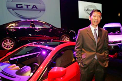 In this Oct. 6, 2009 file photo, Xiaolin 'Charles' Wang, president and chief executive officer of GreenTech Automotive Inc., speaks to reporters near three prototype cars his startup company hoped to build in Tunica, Miss. Mississippi's state auditor Stacey Pickering said Wednesday, July 5, 2017, that the leader of the troubled electric car maker and the company, should repay $6.36 million in state and local aid the company received, plus what Pickering says are penalties, interest and recovery costs. GreenTech promised to invest $60 million and create 350 jobs in Robinsonville.