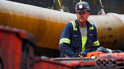 In this Wednesday, June 7, 2017, file photo, a miner works at a coal mine in Friedens, Pa. On Friday, July 14, 2017, the Federal Reserve reports on U.S. industrial production for June.