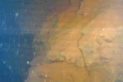 This image captured by an underwater robot provided by International Research Institute for Nuclear Decommissioning shows lava-like lumps believed to contain melted fuel inside the Unit 3 reactor at Fukushima Dai-ichi nuclear plant in Okuma town, northeastern Japan, Friday, July 21, 2017. Plant operator Tokyo Electric Power Co. said the robot found the objects Friday on its second mission inside the primary containment vessel of the Unit 3 reactor at Fukushima, which was destroyed by a massive earthquake and tsunami. Experts believe the fuel melted and much of it fell to the chamber's bottom and is now submerged by radioactive water.