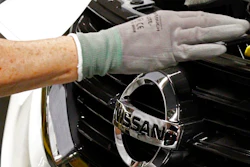 In this April 6, 2016, file photo, a Nissan technician inspects the grill of a new 2016 Altima on the assembly line at the Nissan Canton Vehicle Assembly Plant in Canton, Miss. The United Auto Workers union filed Monday, July 10, 2017, an election petition with the National Labor Relations Board, to force a unionization election at the plant following years-long pressure campaign to build support.
